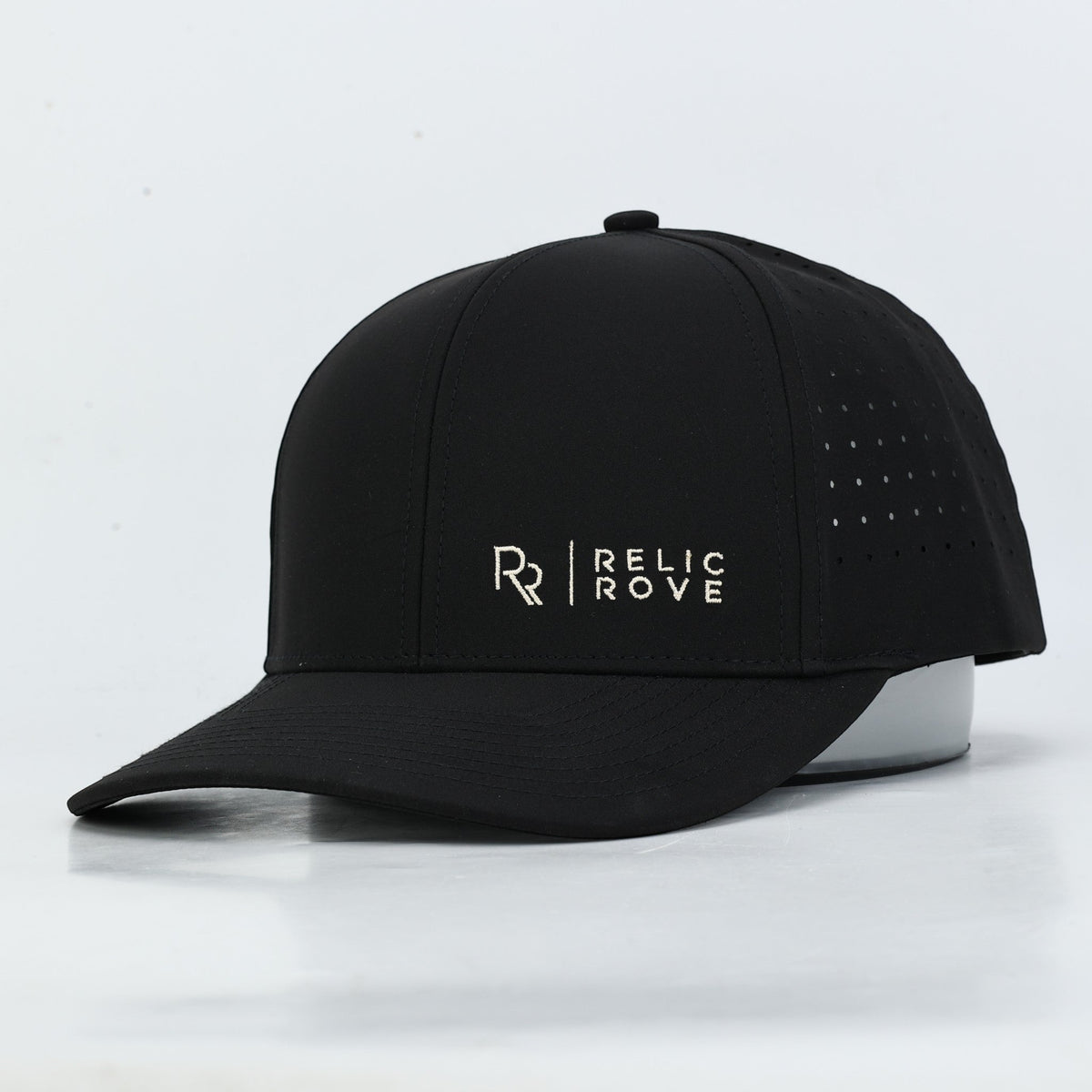 Relic Rove black performance baseball hat with white embroidered logo and side ventilation perforations
